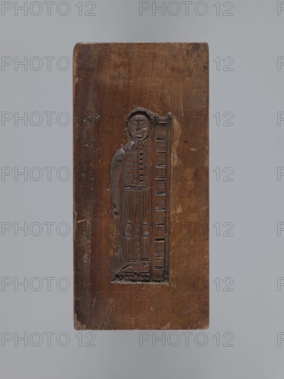 Double-sided gingerbread form. Side A: female figure with a scarf on her head, standing, leaning on a ladder and holding a broom. Side B: baby in swaddling clothes decorated with a geometric ornament. Rectangular shape; on one edge the date 1830 is engraved with the letter S against an anchor and, below it, M mark of the woodcarver or gingerbread maker. Material: gingerbread form wood. Function: form. Style: folk motifs, decorative/applied art. Subject: female figures, children, babies. Maker: unknown woodcarver or gingerbread maker. Date: 1830. Place/region: Silesia Province of Silesia, Prussia; 1742–1918. Dimensions: height 13.5 cm, width 6.5 cm, depth 4.5 cm., A rectangular wooden panel with a carved inset depicting a standing human figure next to a vertical ladder-like element; the panel shows a rich brown wood tone with darker carved lines and lighter worn areas, and the background around the panel is a neutral gray.