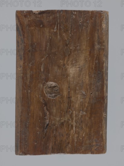 A single-sided gingerbread mould with a wedding ceremony scene, figurative scenes, gingerbread moulds, weddings, male figures, female figures, volutes, folk-style decorations, plant motifs, gingerbread; single-sided rectangular mould with a wedding scene: in the centre a priest dressed in a chasuble with a wig, on his left a man and on his right a woman with their hands joined by the priest, both in richly decorated turn-of-17th/18th-century costumes and wigs — the man in a justaucorps, culottes and stockings, the woman in a long patterned dress with a low neckline; above the heads a decorative finial supported by two columns, the central part a round clock face showing the sun with a human face, with hands on the face, surrounded by an ornament of volutes and plant motifs and a rim with Roman numerals; 18th–19th century, Province of Silesia 1742–1918; form dimensions: height 23 cm, width 15.5 cm, depth 4.5 cm., A rectangular wooden plank shown against a neutral gray background, with a...