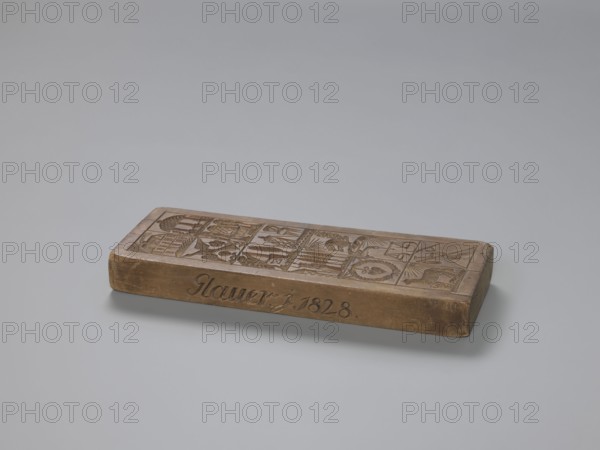 Double-sided gingerbread mould with different representations on both sides, carved by Glauer woodcarver or gingerbread maker; gingerbread, woodcarving, applied art, folk motifs; double-sided rectangular mould: one side with four images — a baby in swaddling clothes and a fish top and, at the bottom, two standing figures: a man and a woman in rural folk costume woman in a long dress holding a handbag; man with a hat and pipe, left hand resting on a shovel; reverse side with twelve images in a rectangular frame depicting a house; a temple with a colonnade; a bird among trees; a beehive against a forest background; a pedestal or altar among trees; a room, with a chair; a military guard in front of a tent with trees in the background; chickens pecking for food; a heart in a wreath; a cupid and scales; a lamb in a meadow; and agricultural tools. The name Glauer signature of the maker is carved on the edge, followed by the date j.1828. Date: 1828. Place: Province of Silesia 1742–1918. Mater...