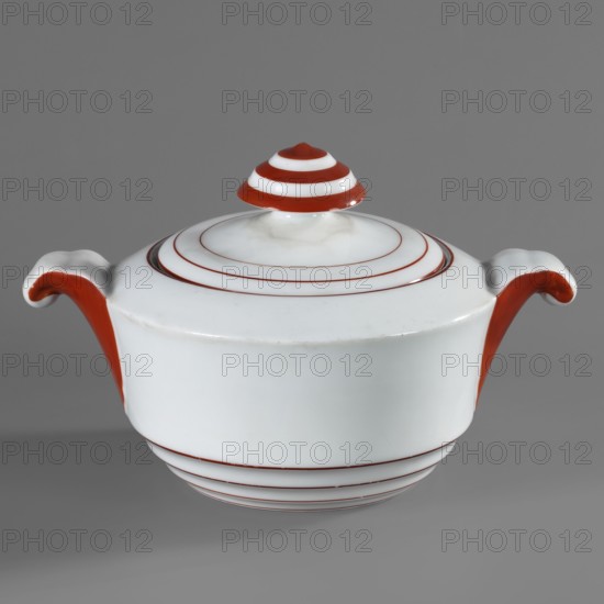 Sugar bowl with lid, Baltyk model, Cmielów faience and porcelain factory; 1804–, maker: Marcinek, Bogumil 1904–1940, sugar bowl, art deco style, vessel; round with recessed profile at the base, two volute fluted convex handles; lid handle shaped like a mushroom. Color decoration: red rims around the lid, bowl, and top of the handles. Ca. 1930, Poland, Cmielów., A white ceramic tureen with a domed lid and a finial is shown against a gray background; the tureen has a smooth rounded body with a pair of curved handles accented in red, the lid and finial feature concentric red rings, and the base has several thin red rings encircling it, with visible colors including white, red, and gray.