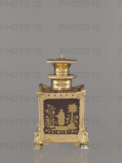 Bottle with lid, Gardner, Francis porcelain manufactory; 1766–1917 maker. Cubic bottle with a profiled short neck and square stopper. Plastic ornamentation on the edges, swan-shaped feet in the late Empire style. Gold-painted decoration with four genre scenes of Chinese people on the four sides. Floral ornament on the top of the bottle and stopper. Fragment of one paw missing; gilding abrasions. c. 1840, Russia. Vessel; height 18.5 cm, width 11.2 cm., A small decorative vessel with a square body and a fitted lid sits against a plain background; the object combines shiny gold metal with dark brown panels featuring gold-painted ornamental scenes, and it rests on ornate gold feet shaped like stylized animal heads; the lid and neck are rounded and polished gold, the body edges and decorative trim are gold with textured patterns, and the panels show gold botanical motifs and a standing figure next to a palm-like tree.