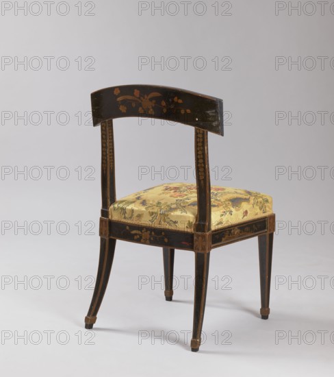 Chair, chinoiserie, flowers, rosettes ornament, floral decoration, classicism style, chinoiserie. CHAIR with a padded seat covered with imitation black lacquer. Supported by four angular, tapering legs with glides, the rear legs arching outward. The seat is roughly square, with high upholstery on springs. Openwork backrest with a top board arched along the back line. Decoration painted yellow, locally applied to an extruded base—on the frame and the top board of the backrest with plant and landscape motifs, and on the ankles above the legs with butterflies and rosettes. Garlands of small flowers adorn all surfaces of the backrest stiles. Flowers adorn the back of the backrest board and rear frame. The front frame of the backrest board is edged with a zigzag pattern; the slats frame the reserves, the edges of the frame, and the bands forming the feet of the legs are painted gold. Seat upholstered in red synthetic fabric, finished with upholstery tape. Ca. 1800, Italy, furniture, seating...