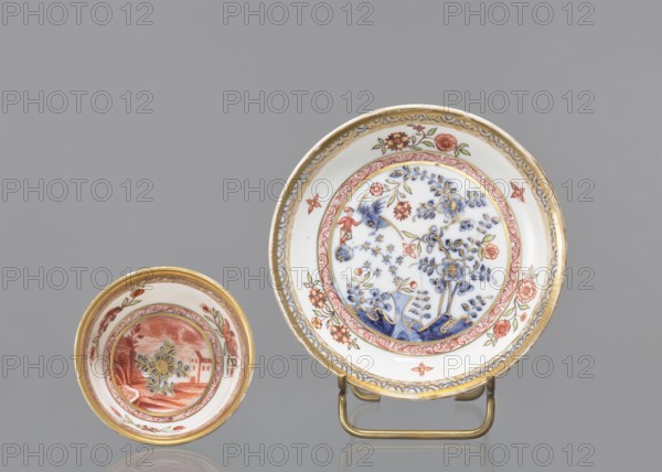 Bowl, House painter co-creator, Ferner, JF ca. 1750, or workshop house painter co-creator; Koenigliche Porzellain Fabrique, Meissen 1710–1763 factory/author. Hemispherical bowl with a rim at the bottom, parted, with a slightly rolled-up edge. Painted in cobalt in a Far Eastern motif with a bird and a rock and with colorful household painting Hausmalerei. Decoration by Fels und Vogel: outside a bird and rock; inside a lying man leaning against a rock, two floral compositions and an architectural motif in the circle of the bottom, around a cobalt branch. Floral decoration with a bird and a rock, cobalt semicircle pattern around the edge, flower in the bottom; bottom rim gilded. Ca. mid-18th century, Meissen, Saxony, Germany. Vessel; height 4.5 cm, diameter 7.8 cm., A group of two decorative shallow bowls displayed against a gray background, one larger bowl on a small metal stand and one smaller bowl placed nearby; the larger bowl has a white interior with ornate floral and botanical patt...