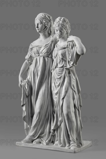Two princesses, the so-called Prinzessinnengruppe, Koenigliche Porzellan Manufaktur KPM; Berlin; 1763–1918, sculptor Johann Gottfried Schadow 1764–1850. Double portraits in porcelain: on a flat rectangular base, two young women with arms around each other in long, antique-style dresses made of thin, draped fabric Luise, wearing sandals, with curling, mid-length parted hair. Luise puts her arm around her sister, resting her hand on her left shoulder; with her right, lowered hand she supports the folds of her dress. Friederike embraces her sister from behind around the waist, her left hand grasping her sister's arm that rests on her shoulder. Ca. 1795–1796, Berlin, Germany. Sculpture; height 55.0 cm, width 35 cm, depth 19.5 cm., A white marble sculpture of two women standing close together on a rectangular base, both wearing draped garments with detailed folds and flowing fabric; one woman has her arm around the other's shoulders while the other holds part of her drapery, their faces sho...