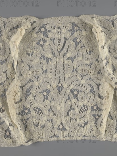 Bodice, lace, provenance unknown, bodices, women's clothing, fashion. In a pattern of rosettes connected by large spiders and heads; pattern of stylized floral motifs. 19th century, France. Clothing accessory. Height 36 cm, circumference 63 cm., A delicate lace panel with an intricate floral and scrollwork pattern in a pale cream color set against a muted gray background, showing openwork areas and solid embroidered motifs, with a few scalloped edges and narrow strips of lace draped over parts of the panel, threadwork forming repeating circular flower shapes and curved vine-like elements, and subtle variations in the cream tone where the lace appears slightly aged or worn.
