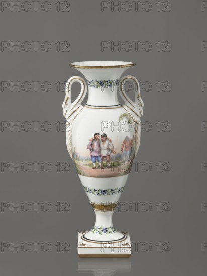 Amphora vase, Imperial Porcelain Factory in St. Petersburg 1744–1917, genre miniatures, genre scenes in landscapes, rural landscapes. Amphora vase with an ovoid body and a slender neck that flares upward; slender, tall foot on a square plinth; two handles in the form of swans. The neck, foot, and lower part of the body are decorated with a colorful trail of small flowers. On the belly, two miniatures depicting rural landscape scenes: a woman doing laundry, leaning over a tub of laundry placed on a low table while a man with a dog watches her; and two men with their arms around each other, one holding a bottle, the third leaning forward in the background. Early 19th century, Russia, St. Petersburg. Figurine/vase. Height 26.5 cm; width 11.0 cm; depth 9.0 cm., A white porcelain urn with a flared rim and a pedestal base against a plain gray background, decorated with gold edging and delicate floral garlands in blue and green, featuring sculpted swan-shaped handles on each side with gold ac...