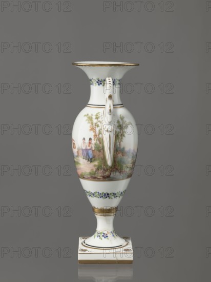 Amphora vase, Imperial Porcelain Factory in St. Petersburg 1744–1917. Amphora vase with an ovoid belly, slender neck flaring at the top, and high foot on a square plinth. Two handles in the form of swans. Colorfully painted: trails of small flowers on the foot, neck, and lower part of the belly. On the belly, two miniatures depicting genre scenes in a rural landscape: a woman with a pole water carrier siudy, koromyslo and a couple with a dog. Base cracked and glued. Early 19th century, St. Petersburg, Russia. Figurine/vase. Height 26.5 cm, width 11.0 cm, depth 9.0 cm. Genre miniatures; genre scenes in landscapes; amphoras; plant decoration; water carriers., A tall, slender porcelain vase with a flared rim and a decorative handle is shown against a gray background; the vase is predominantly white with painted scenes and floral bands, featuring a pastoral scene with people and trees in muted greens, browns, and soft pinks on the body, small blue and green floral garlands near the neck an...