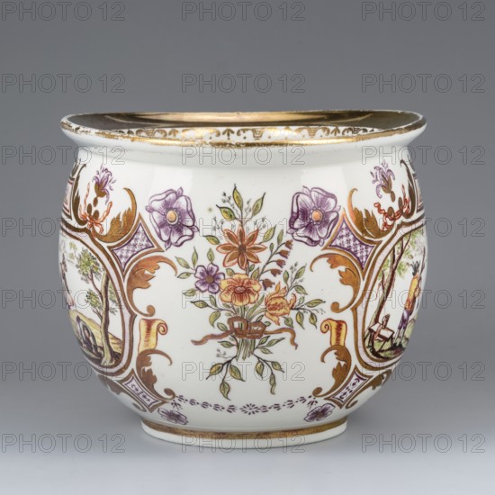 Chamber pot with genre miniatures, Porzellanmanufaktur du Paquier Vienna; 1718–1744. A chamber pot with a spherical, slightly elongated form, rolled-up striped edge and cylindrical handle. On the sides are two genre miniatures with ribald, erotic content within gilded leafy Regency cartouches, complemented by purple Chinese latticework and a flower, a brick-red ribbon motif, and a brick-yellow volute, with two small miniatures in the frame reserves. The miniatures depict: 1 a field scene: two farmers and a woman trying to dissuade them from work by lifting her skirt; 2 a bagpiper playing for a couple dancing in a loving embrace, with rural buildings and a picket fence in the background. Between the miniatures is a bouquet tied with a gold ribbon; along the handle is an ornament with a gold campanula motif; the edge has a wide band of gilding and a volute ornament under the strip; gilding inside the chamber pot. Hausmalerei. Toilet bowl, 1725–1735. Vienna, Austria. Height 12.5 cm; width...