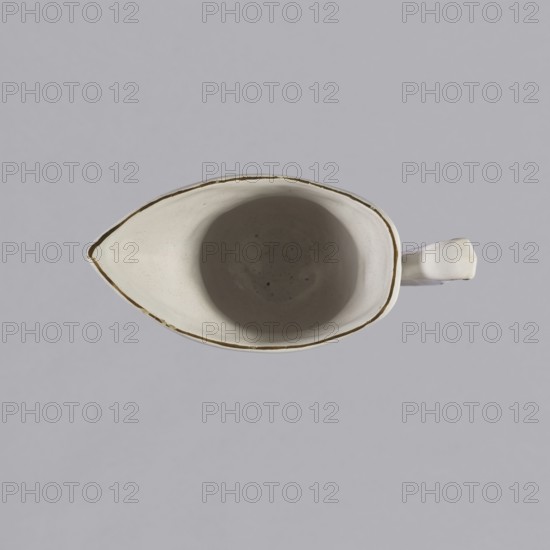 Nalewka, Prószków Slaski faience factory; 1763–1853 maker/manufacturer, floral decorations, locking, carnations flowers, Helmet-shaped Nalewka, locking and fluted surface. The bowl base and vaulted foot are modeled with four leaves. T-shaped handle. Colorful decoration — bouquet with a large purple carnation with three buds and three small yellow flowers. Small projections of flowers and leaves. Brown borders along the handle, edge of the bowl and foot. 1770–1783. Province of Silesia; Silesia; Prószków Slaski. Vessel; height 19.0 cm, width 19.0 cm, depth 9.5 cm., A top-down view of a ceramic pitcher with a pointed spout and a handle visible at the side, the pitcher interior appearing smooth and rounded with a subtle shadow, the rim showing a thin darker outline; colors visible include shades of white and off-white on the pitcher, a darker grayish shadow inside, and a muted light gray background.