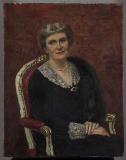 Portrait of Wanda Lepkowska, née Oswiecimska 1866–1937, Roman Kawecki 1868–1938, 1930, painting, height 89 cm, width 69.5 cm, A seated older woman with short gray hair and a pale complexion wears a dark dress with a light lace collar and matching lace cuffs, and a pearl necklace; she sits in an ornate chair with a red upholstered seat and gold and white carved frame, resting her hands on her lap with fingers gently overlapping; a dark fur stole or drapery lies over one shoulder and partly down her front, and a small dark animal with visible eyes is nestled near her hand; the background is a rich red with subtle patterning, and visible colors include gray, pale skin tones, black, dark brown, red, gold, white, and a few touches of pink.