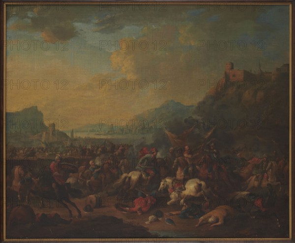 Skirmish against the backdrop of a mountainous landscape; Rubens, Arnold Frans 1687–1719, painter; painting depicting battle scenes and landscapes; Flemish painting; 17th/18th century; oil on panel height 49 cm, width 59 cm; restitution, A large painted scene shows a dramatic outdoor landscape with a broad sky of muted blues, dusty yellows, and grayish clouds. In the foreground a chaotic battle scene is visible with many mounted figures and fallen figures on the ground; horses appear in colors including brown, black, and white. Several figures wear garments in red, green, and blue tones, and some wear head coverings in pale and dark shades. There are a few banners or cloths in warm colors held above the combatants and some smoke or dark haze rising near the center-right. The middle ground contains a busy shoreline or plain with a group of small structures and silhouettes of distant buildings along a waterline, rendered in soft blues and grays. To the right a rocky hillside rises to a f...