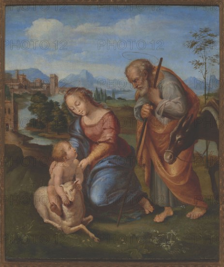 Holy Family with a Lamb, Penni, Giovanni Francesco ca. 1496–ca. 1528, painter; Raphael 1483–1520, painter copy after; religious painting depicting the Holy Family Mary, Joseph, and the infant Jesus with a lamb; scenes against a landscape background; Italian painting and Italian landscape style; after 1507; painting; dimensions: height 43.5 cm, width 38 cm; with frame: height 68 cm, width 59.5 cm, thickness 6.5 cm., A painted scene shows a woman in a red top and blue skirt kneeling beside a small naked child who is sitting on a light-colored sheep; a bearded man wearing muted green and rust-colored garments stands nearby leaning on a staff and a dark donkey is close to him; the background contains a landscape with green trees, a river or body of water, distant bluish mountains, and a pale blue sky with a few white clouds, and the ground in the foreground is grassy with small plants and flowers.