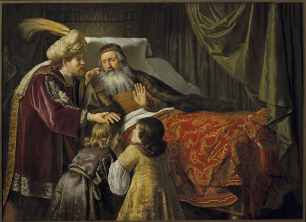 Jacob Blessing the Sons of Joseph, Victors, Jan 1619–1676, painter; oil painting, 1650s; biblical scene depicting Jacob the Patriarch blessing Ephraim and Manasseh Joseph; height 136 cm, width 190 cm; subject inscriptions: Jacob, Ephraim, Manasseh., An interior scene shows an older man with a long gray beard reclining on a bed with a white pillow and a richly patterned red and gold coverlet, a dark fur-lined cloak over his shoulders and a brown cap on his head; he raises a hand while looking toward a younger man standing beside the bed who wears a large cream turban with a yellow plume and a deep burgundy robe trimmed with ornate metallic embroidery. Two children stand at the bedside facing the older man; one child has light blond hair and a brown garment with a tied sash, and the other has darker hair and a gold-striped dress with white sleeves. Behind and around the bed are heavy draperies in shades of dark green and olive, and the overall palette includes reds, golds, browns, burgun...