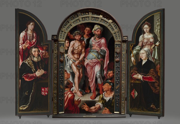 Ecce Homo Triptych, donor portraits on the wings, Heemskerck, Maarten van 1498-1574 painter / author, Ecce homo iconography, Pontius Pilate prefect of Judea; fl. 26–36, Jesus Christ Bible, religious scenes, Margaret the Martyr St.; ?–ca. 303–305, Netherlandish painting, John the Evangelist St.; ?–ca. 100 - iconography, portraits, chalice attribute, dragon attribute, Jan van Drenckwaerdt ?–1549, Margaretha de Jonge van Baertwyck ?-1542, female portraits, male portraits, triptychs, 1544, painting, central part: height 167 cm, width 88.9 cm, thickness 13 cm, with frame: height 188.6 cm central part, width 132.7 cm central part, thickness 13 cm, right wing: thickness 5.5 cm, height 183.5 cm, width 64.8 cm, left wing: thickness 5.5 cm, height 183.5 cm, width 62.5 cm, A painted three-panel altarpiece is shown with an arched central panel flanked by two hinged side panels, all set against a neutral gray background; the central scene features a group of figures arranged within an ornate arched...