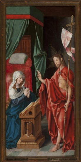 Christ Appearing to Mary, Bartholomäus Bruyn 1493–c.1555, German painting, religious/biblical scene depicting Mary mother of Jesus and the Resurrected Christ, interiors, crosses attribute. Painted c.1515–1525. Painting with frame: height 71 cm, width 35 cm., A vertical painted scene framed by a wooden border shows an interior with a tiled floor in shades of green and gray, a large draped canopy in green with a red border, and a bed with red upholstery and a pale pillow. On the left, a kneeling woman with pale skin and long blond hair peeking from under a white head covering wears a deep blue robe and has her hands clasped in front of a wooden lectern with carved panels and an open book. On the right, a standing man with pale skin, shoulder-length brown hair, and a short beard is draped in a flowing red cloth that reveals part of his torso; he holds a tall staff topped with a cross-like element adorned with a pink and white banner, and he makes a raised gesture with his other hand. Both...