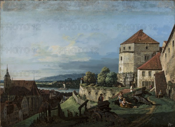 View of Pirna in Saxony, Bernardo Bellotto 1722–1780, oil painting, Venetian veduta city view with staffage, 2nd half of the 18th century; height 55 cm, width 75.5 cm., A panoramic scene shows a fortified stone building with red tile roofs on the right, surrounded by a stone wall and a grassy slope; a few people in period clothing sit and stand near old wooden carriages and a dirt path by the wall, and a group of trees with green foliage rises behind the wall. To the left, a town with clustered buildings and a large church with a steep dark roof stretches toward a wide river where a sailboat floats, and low hills appear on the distant horizon. The sky above is expansive with pale blue tones, soft white and gray clouds, and subtle warm hues near the horizon, while the foreground and architecture feature earthy browns, muted grays, greens, and touches of red.