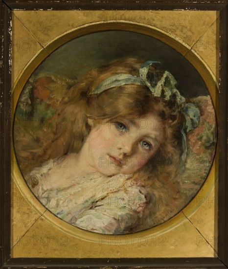 Portrait of a Girl; Konstanty J. Makowski 1839–1915, painter; children's portrait; portrait of a girl; Russian painting; oval portrait; 19th century; oil painting; height 48 cm, width 43 cm; ., A painted portrait of a young girl seen within a circular frame set into a rectangular border; she has light brown hair with a blue ribbon, pale skin with pink cheeks, and blue-green eyes looking slightly toward the viewer; she rests against a patterned cushion with muted reds, greens, and browns, and wears a light-colored, textured garment with hints of pink and blue; the circular frame and surrounding border are gold and brown with worn areas and a few darker spots.