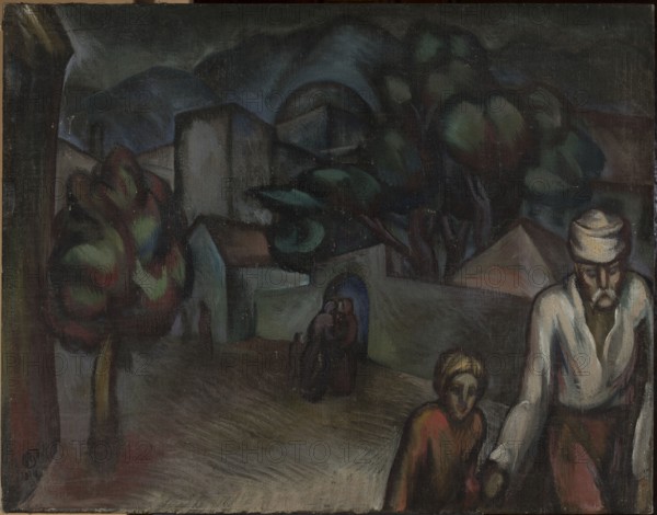 Cityscape with Figures, Roman Petrovic 1896–1947, painter; 1924; oil painting; subject: cityscape with figures and landscapes; style: contemporary foreign painting / art of the former Yugoslavia; dimensions: height 90 cm, width 115 cm; place of creation: Yugoslavia Bosniak., A dark, muted painting showing an outdoor scene with a pathway or open ground in the foreground and clustered buildings, rounded hills, and dense trees in the background; a group of figures is visible, including a bearded man wearing a pale head covering and light-colored shirt who stands at the right edge, and a smaller figure beside him wearing darker, reddish-brown clothing; behind them a pair of cloaked figures stand in a shadowed archway; several trees with foliage in shades of green, red, and blue appear left and center; the sky and distant hills are rendered in deep blues and dark grays, while the buildings and ground show tones of gray, brown, muted green, and touches of ochre.