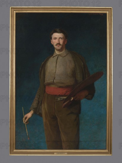 Self-portrait with a palette, Laveaux, Ludwik de 1868–1894 painter, Young Poland style, self-portraits, portraits, iconography: male portraits, palettes, portraits with a palette and brushes, 1892, painting, A framed portrait of a standing man against a deep blue background; he has brown hair and a mustache and wears a grayish shirt with a darker overgarment and brown trousers, with a red sash around his waist. He holds a large brown oval palette under one arm and a thin paintbrush in one hand. The frame is golden and the surrounding wall is gray. Colors visible include blue, brown, gray, red, gold, and a touch of flesh tones.