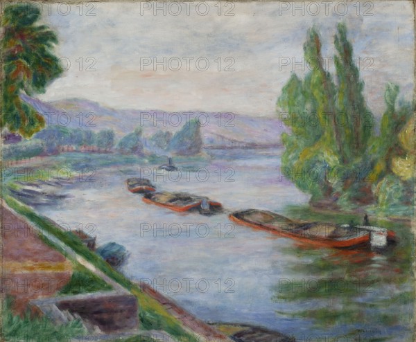 The Seine in Les Andelys, Pankiewicz, Józef 1866–1940, painter; Young Poland style. One of many views of the Seine and its picturesque corners, so eagerly painted by the Impressionists. 1920, oil painting, 54 × 65 cm., A riverside scene showing a calm body of water with a group of small boats moored near the near bank, the boats painted with noticeable red or orange undersides and darker interiors. The near shoreline has areas of green grass and brown earth with a sloping embankment leading down to the water, and a few indistinct objects resting on the bank. On the far bank and in the middle distance there are clusters of trees and tall leafy vegetation in shades of green, with some trees showing darker green and touches of yellow and brown. Beyond the trees, low rolling hills appear in muted purples and blues under a pale sky with soft washes of white, light blue, and hints of pink. The water reflects the sky and surrounding colors in soft blues, greens, and touches of purple, with ge...