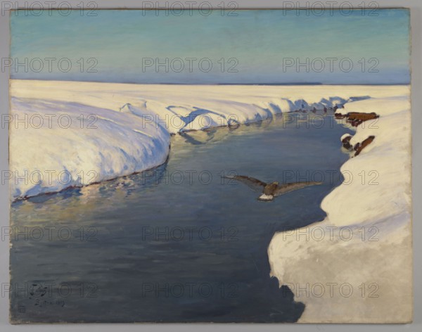 Winter Landscape with a River and a Bird, Julian Falat 1853–1929, painter., rivers, birds, landscapes, winter, winter landscapes. Styles: Japonisme, Young Poland. Julian Falat was a leading Polish landscape painter of the 19th century and a professor at the Kraków Academy of Fine Arts; he depicted Polish nature and gained popularity for his winter, expansive landscapes. Date: 1913. Medium: painting. Dimensions: height 106 cm, width 135 cm; with frame: height 118 cm, width 147.6 cm, thickness 5.5 cm., A snowy landscape with a dark blue, reflective river cutting through a field of white snow under a pale blue sky that deepens toward the horizon; the snow along the riverbank shows soft shadows in shades of blue and lavender and touches of warm beige, while the water contains reflected tones of blue, gray, and hints of green; a dark brown bird with outstretched wings is flying low over the water; a few exposed dark brown rocks or earth patches break the snow on the right bank.