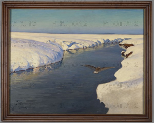 Winter Landscape with a River and a Bird, Julian Falat 1853–1929, painter. Subject: winter landscape with a river and a bird. Styles: Japonisme, Young Poland. Date: 1913. Medium: painting. Dimensions: painting: height 106 cm, width 135 cm; with frame: height 118 cm, width 147.6 cm, thickness 5.5 cm. Notes: Falat was a leading Polish landscape painter of the 19th century and a professor at the Kraków Academy of Fine Arts; he depicted Polish nature and was especially known for his expansive winter landscapes., A framed painting showing a snowy landscape with a dark blue river cutting through banks of white snow under a pale blue and green sky; a dark brown bird with outstretched wings flies low over the water, and there are a few brown rocks or earth patches visible along the snow edges, with soft shadows and reflections in tones of blue, gray, white, brown, and pale green.