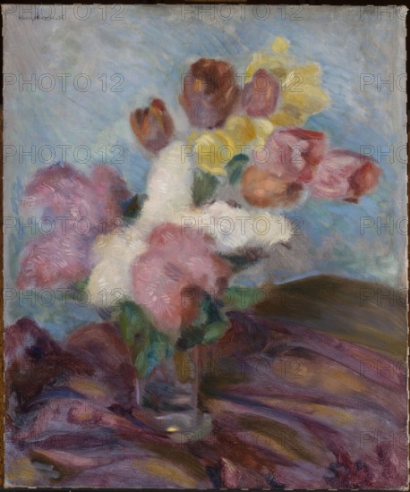 Flowers, Adam Hannytkiewicz 1887–1946, painter; floral still life, oil on canvas, 1935; interwar period, contemporary painting; Poland; height 60.5 cm, width 50.5 cm; provenance unknown., A loosely painted still life of a bouquet in a glass vase sitting on draped fabric, featuring a group of soft, rounded blossoms in shades of pink, white, yellow, and reddish-brown, with several green leaves around the stems; the background is a textured wash of pale blue with streaks of lighter blue and hints of gray, and the fabric beneath the vase shows sweeping strokes of deep purples, burgundy, brown, and muted ochre tones.