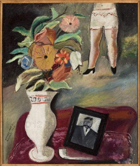 Anniversary of death, Brzeski, Janusz Maria 1907-1957 painter, still lifes, interwar period, contemporary painting, flowers in vases, pictures within pictures, underwear, 1932, Poland, painting, height 55 cm, width 46.2 cm, A painted scene shows a large white vase with decorative trim holding a lush bouquet of flowers and leaves in shades of green, yellow, orange, pink, red, blue, and white, set against a dark and muted background with areas of gray and black. To the right, the lower half of a figure is visible wearing light-colored garments with decorative red trim and black shoes, standing against a textured backdrop with green and brown tones. In the lower area, a deep red surface supports a framed portrait with a dark frame and a monochrome depiction inside, alongside a curved white object, all resting on a mottled red and pink cloth. The overall palette includes white, green, yellow, orange, pink, red, blue, black, gray, and brown.