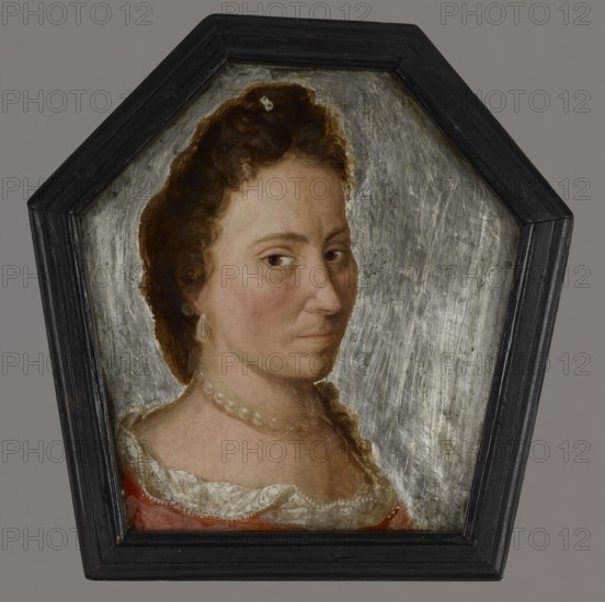 Coffin portrait of Teresa Bojanowska, née Sokolnicki 1666–1700, unknown artist. A young woman depicted in a bust, turned three-quarters to the right, gazing directly at the viewer. Her face is long and slender, slightly shadowed on the left; straight nose, dark brown eyes, thin brown eyebrows with a delicate vertical wrinkle between them. Small thin mouth. Long brown fluffy curls fall freely over her left shoulder, one delicately curled lock visible. Hairstyle slightly pinned up above the forehead with a single strand secured by a small clip possibly set with diamonds. Slightly elongated pearl earring in the right ear and a short string of pearls around her neck. She wears a semicircular light red dress with a ruffled neckline trimmed with white lace. Background unpainted, neutral metallic color with traces of scrubbing. Framed in a black mahogany profiled frame with a wooden backing; portrait complemented by a lead plate with an inscription. Circa 1700, Greater Poland. Painting, hexag...