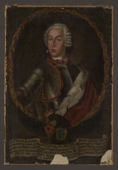 Portrait of Leon I Michal Radziwill 1722–1751, unknown Polish painter. Oval portrait surrounded by a painted laurel wreath inscribed in the rectangle of the painting. In an oval: a half-length portrait of a young man, his torso three-quarters turned to the right and his face three-quarters turned to the left, with his right arm extended to the side, wearing a small powdered wig with a pigtail, armored with a red cloak with ermine lining draped over his left shoulder. A white shirt is visible from under the armor, as are red ruffles at the neck and shoulder strap. The face is elongated with a large, slightly convex nose, a high forehead, and gray-green eyes. The background in the oval is gray-green, smooth, and lighter near the head on the right. The portrait rests on the back of a black eagle with outstretched wings, a ducal mitre on his head, and the Trumpets coat of arms on his chest. In its beak it holds the Bawola Glowa Siesicki coat of arms, and in its talons a white ribbon with a...