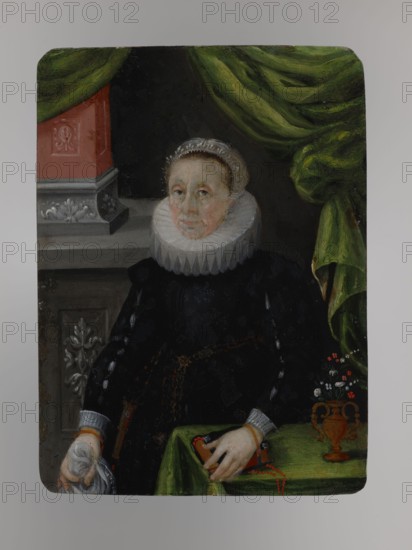 Portrait of Anna Kettler, née Duchess of Mecklenburg 1533–1602, unknown author, miniature possibly 1650, height 13.9 cm, width 10.0 cm; three-quarter female portrait showing costume and interior/architectural elements; copies, foreign miniatures., A seated older woman with a pale face and light hair wears a white ruffled collar and a dark dress, her expression neutral; she has a white cap edged with lace and her hands rest on a green-covered table and hold a white cloth and a small red object. Behind her a draped green curtain hangs to one side, and to the other a decorative architectural element in muted red and gray is visible. On the table there is a small ornate vase with a group of tiny white and red flowers. The overall palette includes black, white, green, red, gray, and brown.