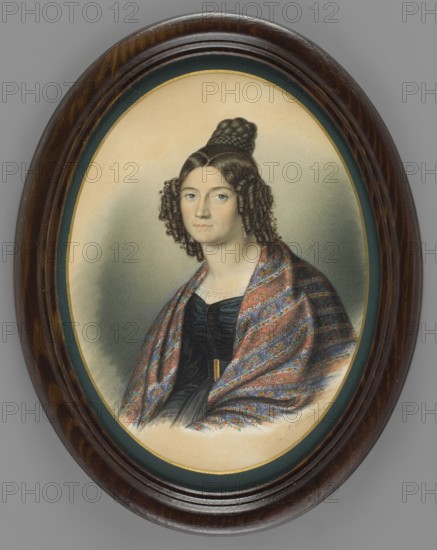 Baroness von Meyerhofen, Schiavoni, Natale 1777–1858 painter; aristocracy; women's portrait en three-quarters; female portrait; women; hairstyles; foreign miniatures; purchase provenance; shawls; baronesses; bun hairstyle; 1835; miniature; height 22.5 cm; width 18.2 cm, An oval framed portrait of a woman with fair skin and dark brown hair styled in tight ringlets at the sides and a braided bun on top, wearing a dark dress and a patterned shawl with red, blue, green, and gold tones draped over her shoulders; the background is a soft gradient of gray and beige, and the frame is a polished dark brown wood with an inner green and gold border.
