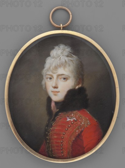 Adam Charles, Duke of Württemberg 1792–1847 in the uniform of the hussars of the imperial bodyguard of Alexander I. Painter: Domenico Bossi 1765–1853. Bust in profile, head three-quarters to the left; fair coiffed hair. Red uniform of the imperial bodyguard braided with gold, brown fur collar on a pink lining, black cravat; star of the Order of the Golden Eagle of the Royal House of Württemberg pinned on the left. Background: dark. Frame: narrow medallion border. Painted in St. Petersburg in 1805 to commemorate his awarding of the title of reigning ruler of the Duchy of Württemberg. Traces of a signature at the bottom left: ...pinxit 1805. Medium: miniature. Dimensions: height 7.6 cm, width 6.5 cm., An oval miniature portrait set in a gold frame shows a young person with pale skin and light hair styled up in a tousled topknot, wearing a red coat with elaborate gold embroidery and decorative buttons and a dark fur collar; the face has light-colored eyes and a neutral expression, and the...