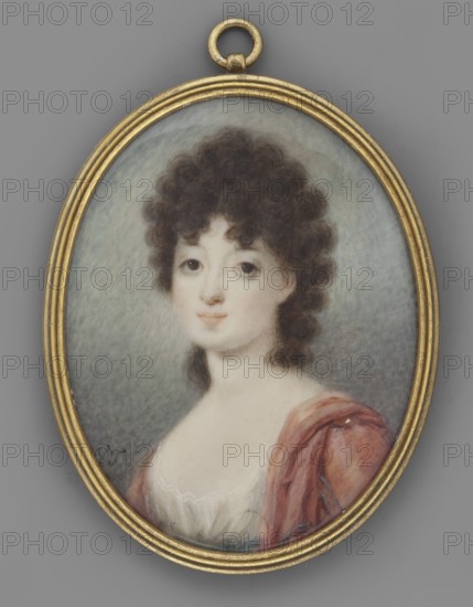 Zofia, née Czartoryska, wife of Stanislaw Zamoyska 1778 or 1780–1837. Portrait miniature, 1803, Poland. Bust three-quarters to the left, head almost straight. Dark brown hair in abundant curls to the shoulders, black eyes. She wears a white dress tied at the waist with a blue ribbon and a red shawl in a dusty pink with a narrow blue border on the shoulders. Grayish-blue background. Brass frame with profiled rim and ring for hanging. Miniature, height 6.2 cm, width 4.8 cm. Amateur painter; genre: Polish miniatures; portraits en trois-quarts; portraits of women; hairstyles., An oval portrait in a gold frame shows a young person with curly dark brown hair and fair skin, facing forward with a neutral expression. The background is a soft gradient of pale gray and light blue. The subject wears a white garment with a low neckline and a draped outer cloth in shades of reddish pink and muted purple. The frame is metallic gold and the outer area surrounding the frame is medium gray.