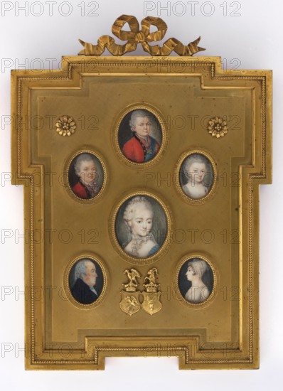 Ignacy Swidzinski, Starost of Lityn born c. 1740, brother of Michal, Marianna and Bona; painter unknown role/classification. The Lopienski Brothers Warsaw; bronze company; 1884–1950. Miniature portrait 1700, Poland, height 3.8 cm, width 3.6 cm. Subject: man visible to the waist, 3/4 left—silver-grey wig, hazel eyes. Costume: white shirt, black zupan, red kontusz with black trim; orders and sash of the Order of St. Stanislaus and the Order of the White Eagle. Coats of arms: Topór, Pólkozic; at the bottom of the 20th-century gilded bronze binding the coats of arms of Slepowron and Pólkozic. Background: dark grey on the left, sandy-olive grey on the right. Genres/tags: portraits en trois-quarts, Polish miniatures, portraits of men, nobility, family, orders, costumes., A gold rectangular frame with stepped corners and a decorative bow at the top contains a group of small oval portrait miniatures set into the gold surface; the frame and background are gold with some darker shadowing. The mi...