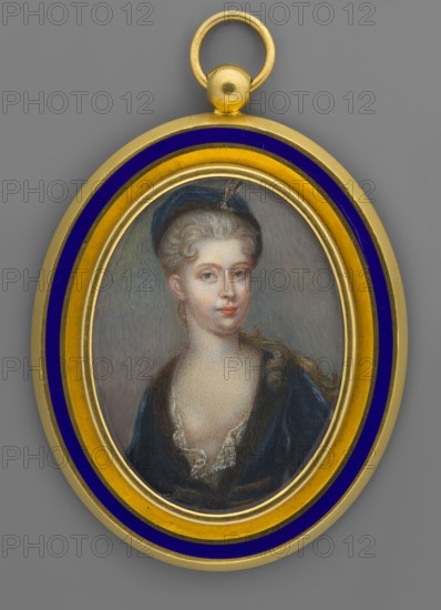 Urszula, Countess Michalowa Wandalin-Mniszchowa, née Zamoyska 1750–1808, miniature portrait, ca. 1780. Bust almost straight, head slightly to the right. Powdered blonde hair combed up, falling in curls over her shoulders; navy blue bonnet with brown fur rim trimmed with a diamond egret. Deep neckline, chemise with transparent lace; navy blue dress trimmed with brown fur and braided details—perhaps a Polish costume. Background: gray. Double glazed; frame secondary from the first quarter of the 19th century, gilded bronze with a strip of sapphire enamel. Miniature: height 4.9 cm, width 3.8 cm. Unknown artist. Subjects: aristocracy, female portrait, three-quarter view., An oval pendant with a gold and deep blue outer border contains a painted miniature portrait of a woman shown from the chest up; she has pale skin, light hair pulled back with a dark blue headpiece, light-colored eyes, and a faint neutral expression; she wears a dark blue garment with a low neckline edged with light lace a...