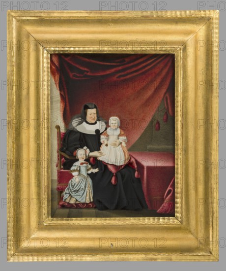 Sophie Eleonore von Sachsen 1603–1671 as the widow of Georg II von Hessen-Darmstadt with her grandchildren Louis VII 1658–1678 and Augusta Magdalena 1657–1674, after Johann Spilberg; unknown German painter. Interiors room, group portrait mother with two children. Sophie Eleonore seated in a red-upholstered armchair in widow's robes — black dress, white collar, black bonnet; on her knees the future Prince Louis VII, standing on a red cushion: red bonnet with white trim, white chemise, red dress with blue-and-white collar, white apron. Beside them stands Augusta Magdalena in a blue-and-brown bonnet with red ribbons, white-and-blue lace collar with red bow, white blouse, yellow patterned skirt, and blue-and-white overdress with brown embroidery. At right, a table covered with red fabric. Background: crimson curtain, left white and olive wall, right olive column, similar floor. Frame: gilded wood. 1660, Germany. Miniature; height 23.0 cm, width 18.0 cm., A framed portrait shows an older se...