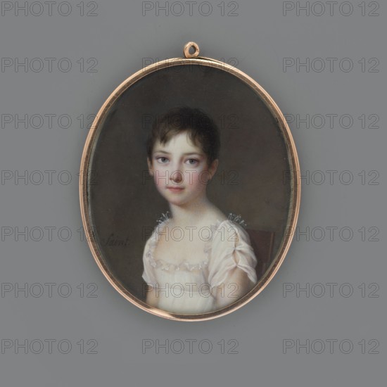 Anna Sapieha as a child, later Princess Adamowa Czartoryska, Saint, Daniel 1770–1847 author; Bust 3/4 left, head almost straight; short dark brown hair; white dress of thin fabric—low-cut with a transparent ruffle at the bodice, short slit sleeves; uniform grey-brown background; miniature, gilded bronze narrow oval rim, 1810, France; height 6.6 cm, width 5.3 cm., An oval pendant with a thin gold frame contains a painted portrait of a young person with short dark brown hair and pale skin, wearing a white, sheer dress with frilled shoulders; the sitter faces forward with a neutral expression and light-colored eyes, set against a dark, muted background, and the pendant rests on a flat gray surface.