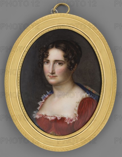 Portrait of a Young Woman in a Red Dress, unknown artist, bust three-quarters left. Dark hair with curls at the sides, braided basket at the back. Red Empire dress with diamond neckline around a white gauze ruffle; on the shoulder a taffetic shawl with green and orange stripes with navy blue piping; at the waist a gold triple cord belt with an oval brooch. Background dark, lighter on the right. Frame: slightly recessed oval frame ornamented with braid all around, profiled in gilded gilded brass. 1820, miniature; height 16.3 cm, width 11.2 cm., A painted oval portrait set in a gold-colored ornate oval frame shows a woman with dark brown curly hair styled close to her head, pale skin, and a neutral expression; she wears a red dress with a low neckline trimmed with ruffled white fabric and a glimpse of a blue garment or drapery at her shoulder, against a dark gray to black background, with the frame and hanging loop in shades of gold and the overall palette including red, white, blue, bro...