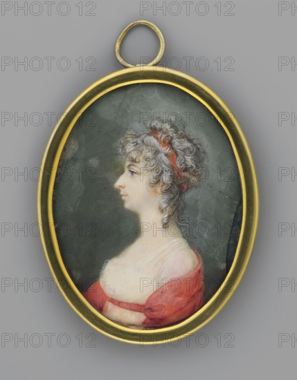 Portrait of a Woman in a White Empire Dress with a Red Shawl, Auvigny, Charles d' 1760–1830 painter. Women; female portrait; Polish miniature; profile portrait; hairstyles; costumes. Portrait of a woman, torso in left profile, dark powdered hair in loose curls on the forehead, temples and neck, tied with a red ribbon; profile with a sharp, aquiline nose and slightly receding chin; intensely blue eye. White Empire dress with lace at the bodice, red shawl and belt. Background: off-green. Binding: narrow gilt bronze frame. 1801. Poland. Miniature; height 6.4 cm, width 5.1 cm., An oval pendant with a gold-colored frame contains a painted profile of a woman with light skin and curly grayish-white hair tied with a red headband; she faces left and wears a low-necked garment showing bare shoulders with a red outer fabric and a pale inner fabric against a dark muted green background.