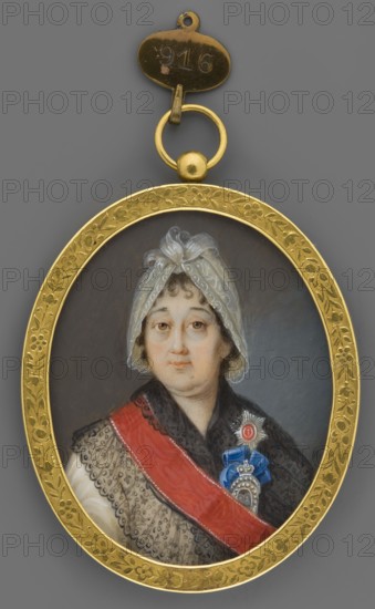 Varvara Ivanovna Princess Prozorovskaya 1750–1806, wife of General Alexander Suvorov. Portrait miniature by Ivan Grigoryevich Grigoryev 1780–post 1833, goldsmith IG fl. 1780. After 1801 she received the Order. Subject: Varvara Ivanovna Suvorova née Prozorovsky, Dame of the Order of St. Catherine the Martyr. From the princely Prozorovsky family; elder daughter of General Ivan Andreevich Prozorovsky and Prince Maria Mikhailovna Golitsyn 1717–1780. Depicted in contemporary costume and headgear; female portrait, foreign miniature. Kosciuszko Uprising 1794 — contextual reference. Russia. Miniature, height 6.6 cm, width 5.3 cm., A painted oval miniature of an older woman set in a gold frame with floral engraving and a small attached gold loop and oval tag; the woman faces forward with a neutral expression, wearing a white patterned cap tied at the top, a dark shawl with lace edging, and a red sash across her chest alongside a blue and silver decorative badge; background is a muted gray, and ...