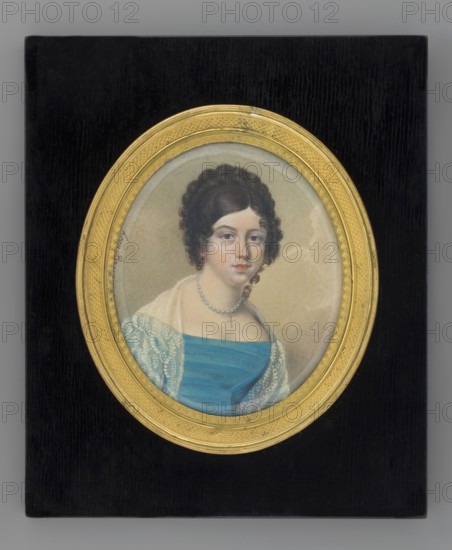 Portrait of Joanna Duninówna. Leon Brzezinski 1809–1865, painter. Miniature, 1833, France. Almost full-length bust, three-quarter portrait of a woman: dark brown hair in spiral curls around the face with a braided crown at the top of the head. She wears a string of pearls with a cross, a blue dress with horizontal stripes, and a white lace shawl ornament made using the scratching technique. Greenish-grey background, lightened on the right. Frame: ornamented recessed oval border of gilded bronze in a rectangular black-polished board; beveled glass. Signature: Leon Brzezinski 1833. Inscription on the back: Joanna Duninówna / in 1833. Miniature, height 10.8 cm, width 9.0 cm. Genres/subjects: jewellery, aristocracy, portraits of women, Polish miniatures., A small oval portrait set within an ornate gold frame rests on a rectangular black background; the portrait shows a woman with dark brown curly hair styled up, pale skin, and a neutral expression, wearing a blue off-the-shoulder dress and...