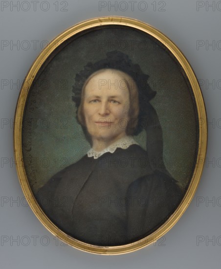 Portrait of the artist's mother, Albertyna Ciesielska née Cienkusz, wife of Kazimierz Ciesielski, painted by Wladyslaw Ciesielski 1845–1901. Portrait of the artist's mother in mourning attire. Probably painted based on a photograph, as evidenced by the simplified flat modeling of the figure. 3/4 bust turned left, head nearly straight. Gray-blond hair with a black cap and a wide ribbon falling over the shoulder; white lace collar at the neck; black dress. Greenish background with greenish-brown upper area. Inscription: ALBERTYNA CIESIELSKA. Binding: narrow gilt-bronze border with double fluting. 1878, France. Miniature; height 15.1 cm, width 12.4 cm., An oval portrait of an older woman set in a gold frame; she wears a dark garment with a white lace collar and a black bonnet or headpiece with a dark ribbon, and her hair is light brown; her skin is pale with subtle rosy tones and a neutral expression on her face; the background is a muted greenish-blue, and the frame shows gold and brass ...