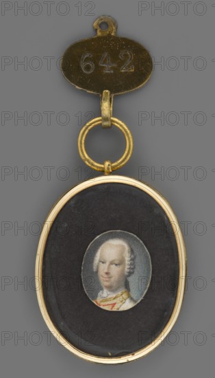 Ludwig IX, Landgrave of Hesse-Darmstadt 1719–1790. Painter: Johann Ludwig Strecker 1721–1799 and unknown painter. Subject: young men, rulers; shoulder-length portrait, male portrait 3/4 left. Depicts soldiers uniform, borders, insets. Hairstyle: wig with a katogan. Foreign miniatures. Visual description: shoulder-length, blue eyes, white low wig, white cravat, light cream uniform with pale yellow borders and red inset. Background: gray-blue. Binding: gilded bronze medal. Date: 1750. Place of origin: Germany. Medium/format: miniature. Dimensions: height 14 cm, width 12 cm., A small oval pendant with a gold-colored metal frame and connecting rings, hanging from a gold-colored oval tag; inside the pendant is a dark background with a small circular painted portrait of a person with light skin and powdered light-colored hair, wearing clothing that includes pale and gold tones and a hint of red, all shown against a gray overall backdrop.