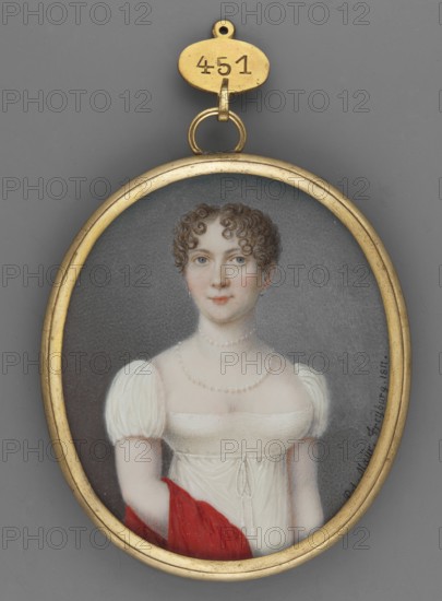 Portrait of a Young Woman in a White Empire Dress, Peter Mayr 1758–1836. Standing half-length, three-quarter to the left. Blond hair in curls, dark eyes. White Empire dress with a neckline, two strings of pearls one shorter, one longer at the neckline; a red taffeta shawl draped over the right hand. Background gray at the bottom, blue at the top. Miniature painted 1811. Height 6.9 cm, width 5.9 cm. Narrow medallion frame of gilded bronze. Style: Empire. Classification: portrait, woman, miniature., An oval gold-framed pendant showing a painted portrait of a young woman with fair skin, curly brown hair, blue eyes, and a neutral expression, wearing a white high-waisted dress with short puffed sleeves and a delicate pearl necklace, holding a red cloth draped over her arm, set against a muted gray background, with the frame and hanging loop in gold.