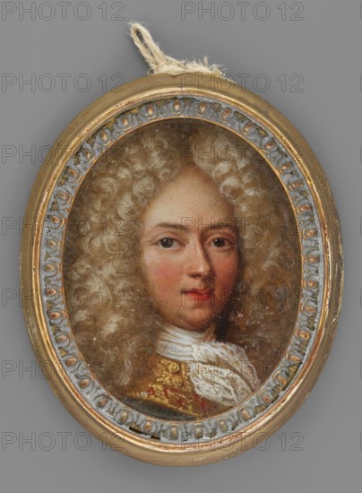 Portrait of a young man in a light lion-style wig self-portrait?, Netscher, Caspar 1635/1636–1684, male portrait, aristocratic subject, lion-style hairstyle. Bust 3/4 left, lion-style wig parted in the middle and falling in curls over the shoulders, high forehead, dark eyes, regular features, pink cheeks and lips. A white lace cravat tied in a knot at the neck; the collar is richly braided with gold and has a wide red edge. Background almost invisible. Oval wooden frame with plaster ornaments around the rim, gilded and patinated in green and blue. 1680, miniature; height 4.4 cm, width 3.5 cm., An oval painted portrait of a person with pale skin and rosy cheeks, shown from the shoulders up and wearing a voluminous curly wig in shades of light beige and cream, set within a decorative oval frame with metallic gold and muted bluish-gray details; the subject has brown eyes and slightly red lips and is dressed in a garment with white fabric at the neck and a richly patterned section in gold ...