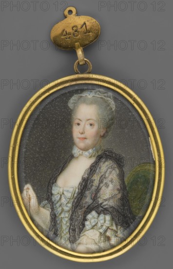 Portrait of Lady E. Maslyn in ball gown with a black lace mantilla on her shoulders; unknown artist; women; portraits; female portraits; foreign miniatures; costumes; hairstyles; Seated, waist-length half-length, turned 3/4 to the left; powdered hair or wig; white bonnet; grey eyes; white bow with blue stripes at her neck; black lace shawl on her shoulders; green chair upholstery; background grey; binding: gilded bronze, narrow profiled medallion rim. Elizabeth Christina of Brunswick-Wolfenbüttel, Queen of Prussia 1716–1792, 1750–1770; miniature; height 5.4 cm, width 4.4 cm., An oval gold-framed miniature portrait pendant shows a woman seated against a dark background, wearing a light-colored dress with pale blue bows and a sheer dark shawl draped over her shoulders; her hair is powdered light gray and styled up, and her complexion is fair with subtle blush; the pendant has a small gold loop and tag above it, and the visible colors include gold, gray, light blue, pale pink, cream, blac...