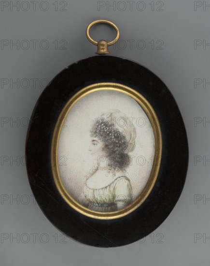 Louise Henrieta Caroline of Hessen-Darmstadt 1761–1829, Grand Duchess of Hessen and bei Rhein, wife of Ludwig I, called Princess George; unknown amateur painter; miniature portrait, profile of a woman in dress and hairstyle, jewelry; foreign miniature; 1800; height 6.5 cm, width 5.1 cm; provenance: repossession Jelenia Góra., An oval framed miniature portrait hangs against a gray background; the frame is dark brown or black with a gold inner rim and a small gold ring at the top. Inside the frame is a penciled or lightly colored profile of a woman with dark curly hair and a pale headscarf, wearing a pale green dress and a string of pearls around her neck. The portrait area is off-white with fine crosshatching shading. The visible colors include gray, black, gold, pale green, dark brown, off-white, and pale skin tones.