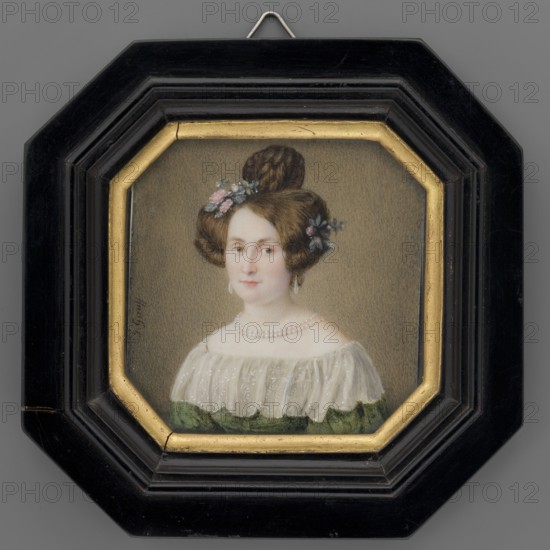 Portrait of Pastor Kraus's wife in a green dress decorated with a berta, Gauff, Johannes 1804-1858 painter, clergy pastor's wife, flowers roses in her hair, portraits woman, shoulder-length, left, headgear shinpiece decorated with roses, women, foreign miniatures, repossession Jelenia Góra, 3/4 bust left. Dark blonde hair decorated with sprigs of pink roses, hazel eyes; pearly dormeuses in her ear, double string of pearls around her neck, olive dress with white muslin lace berta-type ruffle at the neckline. Background: sand-gray. Binding: black varnished wood, brass rim in the middle. 1840–1850, Germany; miniature; height 7.4 cm, width 7.3 cm., A framed painted portrait of a woman shown from the shoulders up inside an octagonal black frame with a gold inner border; she has fair skin and brown hair styled in an updo with braided sections and small floral decorations in pink and blue, and she wears drop earrings and a double-strand pearl necklace; her dress has a white translucent ruffle...