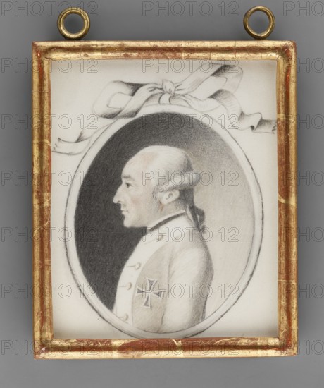 Charles Ludwig, Prince of Anhalt Bernburg 1723–1800, unknown painter amateur, aristocratic portrait of a man in profile; foreign miniature; ca. 1800; miniature; height 11.7 cm, width 9.5 cm, A framed oval portrait of a man in profile rendered in shades of black, gray, and white, set against a darker oval background inside a lighter rectangular mat; the man has a powdered hairstyle with a tied queue at the back and a pale complexion with subtle reddish tones on his cheek, and he wears a light-colored coat with a decorative cross-shaped insignia on the sleeve; a ribbon motif in gray tones appears above the oval, and the rectangular frame is gilded with worn gold and reddish-brown areas, all shown against a neutral gray backdrop.